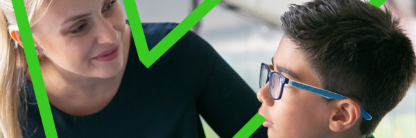 Primary school teacher guiding a student using positive behaviour support strategies