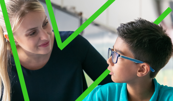 Primary school teacher guiding a student using positive behaviour support strategies