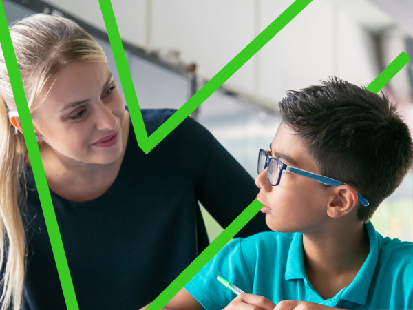 Primary school teacher guiding a student using positive behaviour support strategies